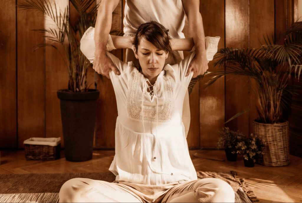 Professional therapist performing a Traditional Thai Massage and stretching at Amara Thai Bryant Park
