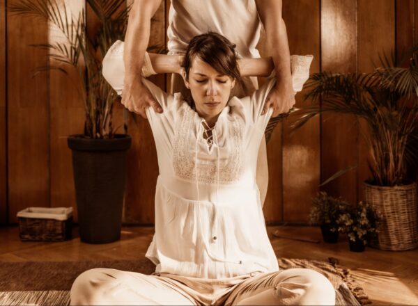 Professional therapist performing a Traditional Thai Massage and stretching at Amara Thai Bryant Park